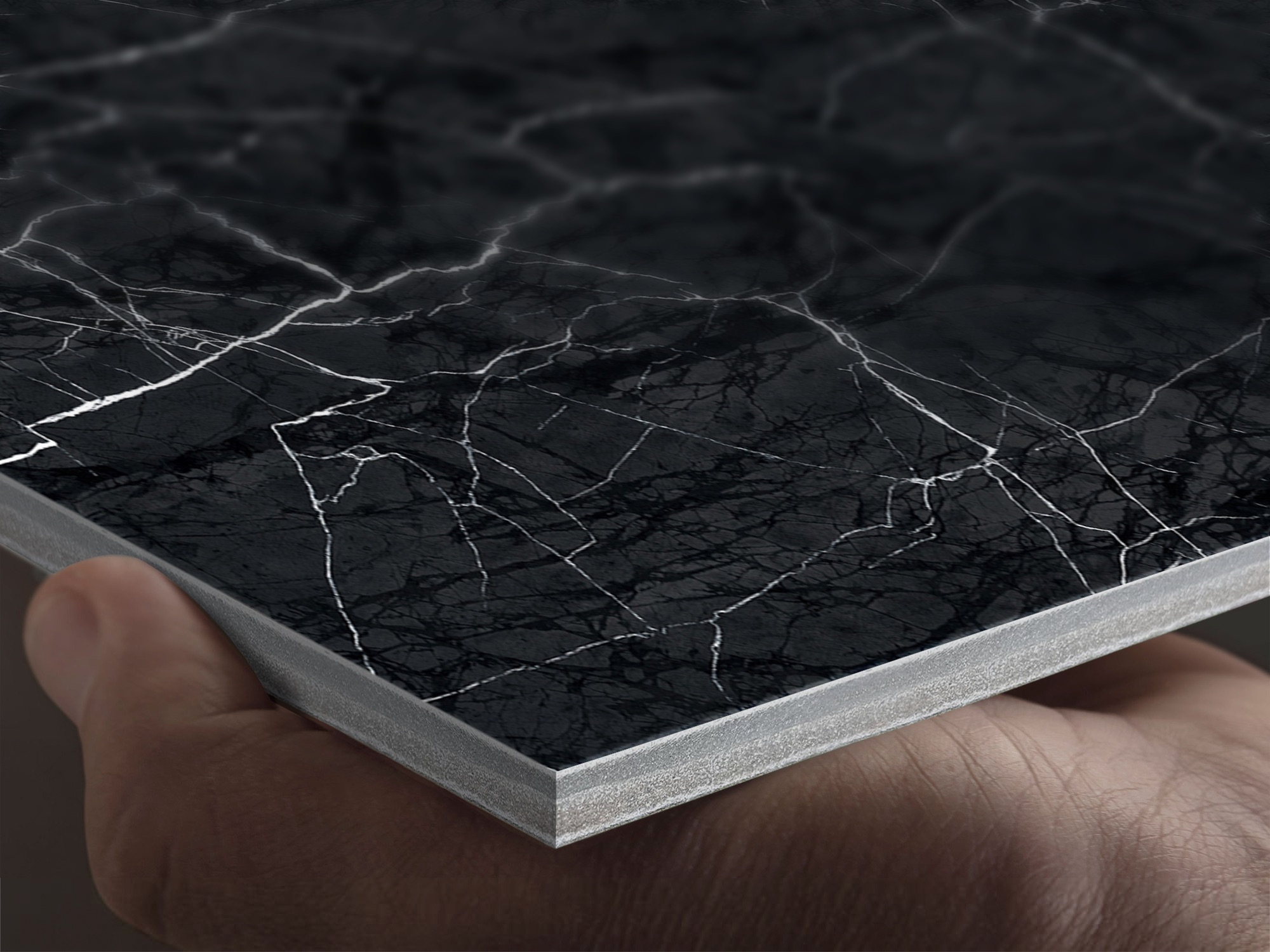 Close-up of a black marble-textured fibre cement panel with a cracked marble design, showcasing durable construction and realistic stone finish.